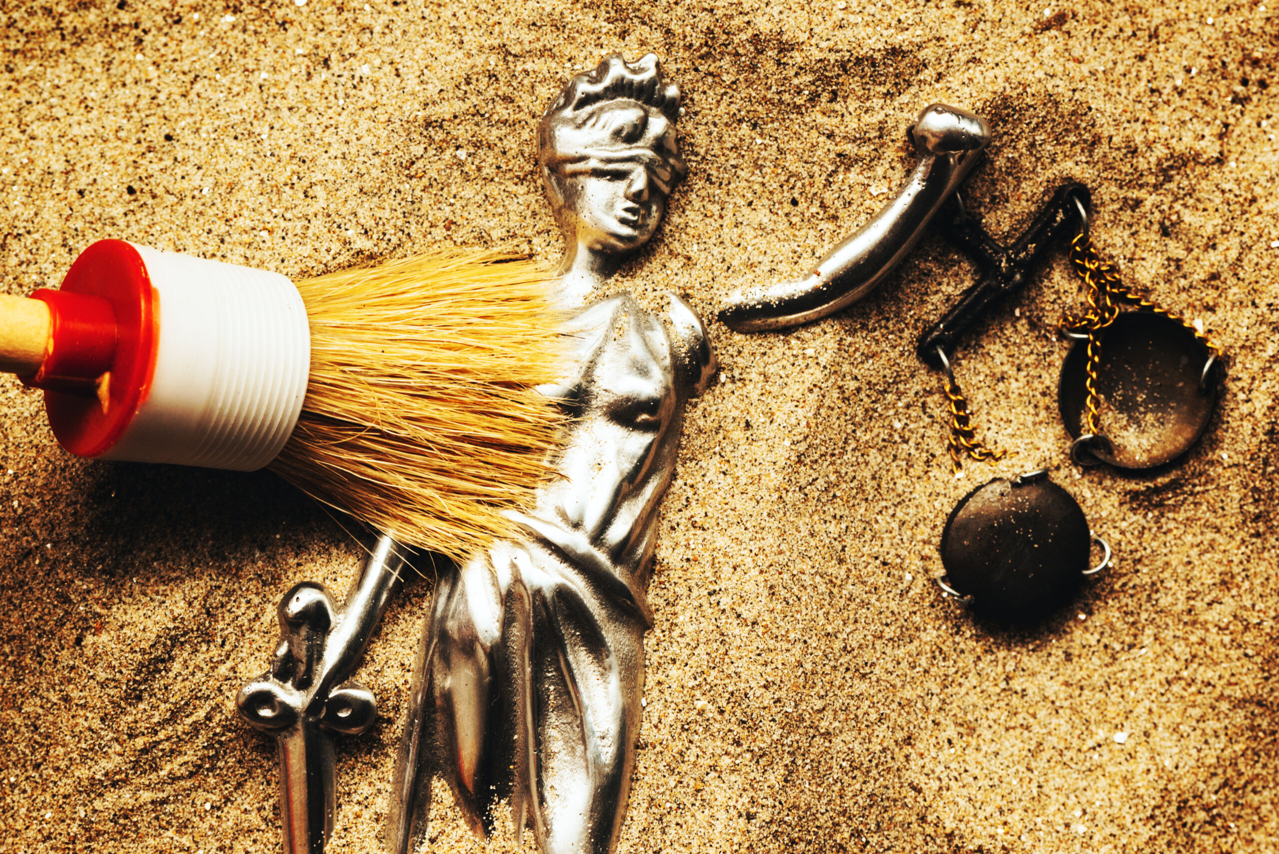 Discovering,Justice,Figure,Buried,In,Sand,During,Police,Forensic,Investigation,